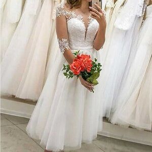 Cream A-Line Plunge Wedding Gown